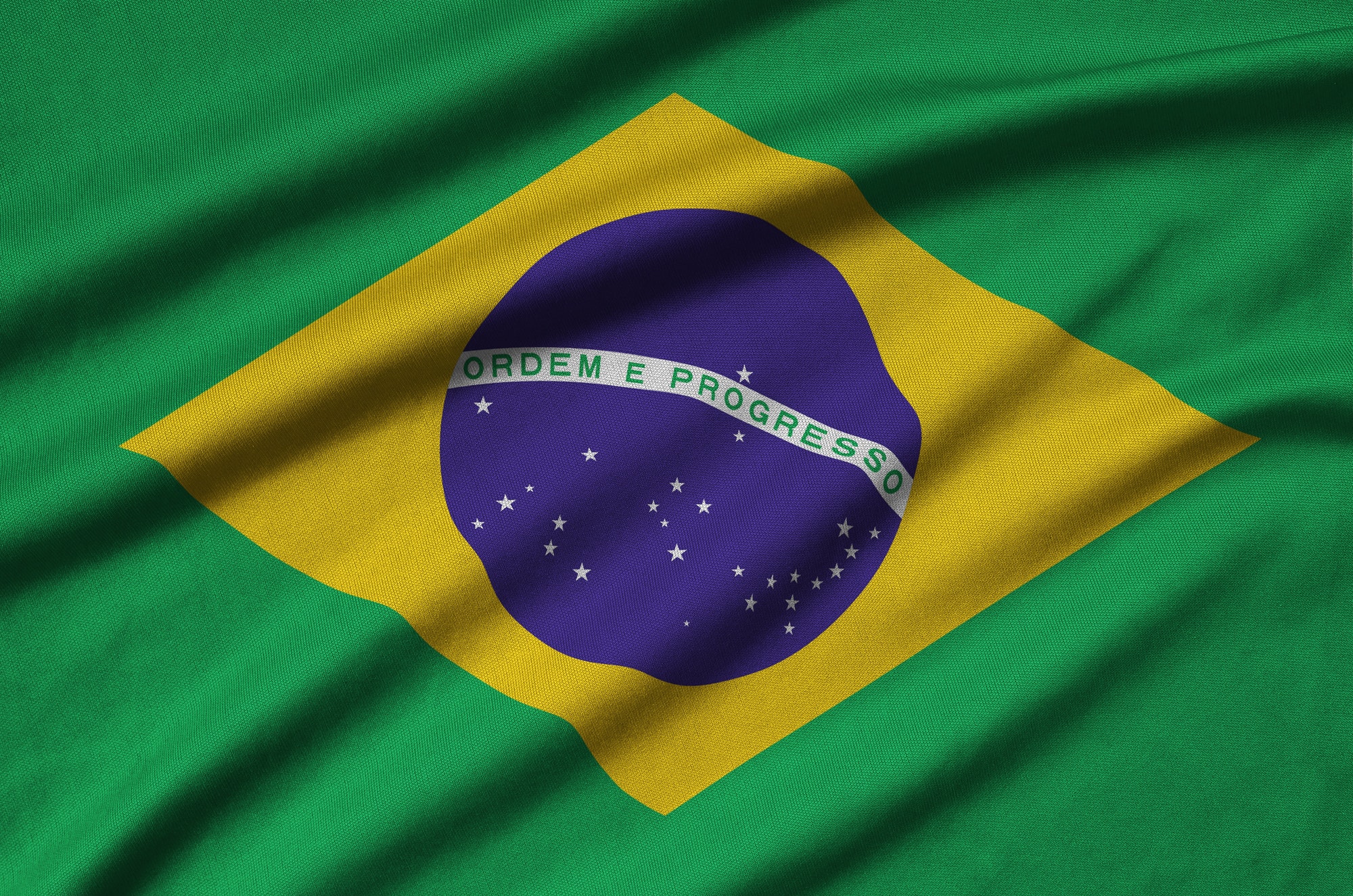 brazil-flag-is-depicted-on-a-sports-cloth-fabric-with-many-folds-sport-team-waving-banner.jpg