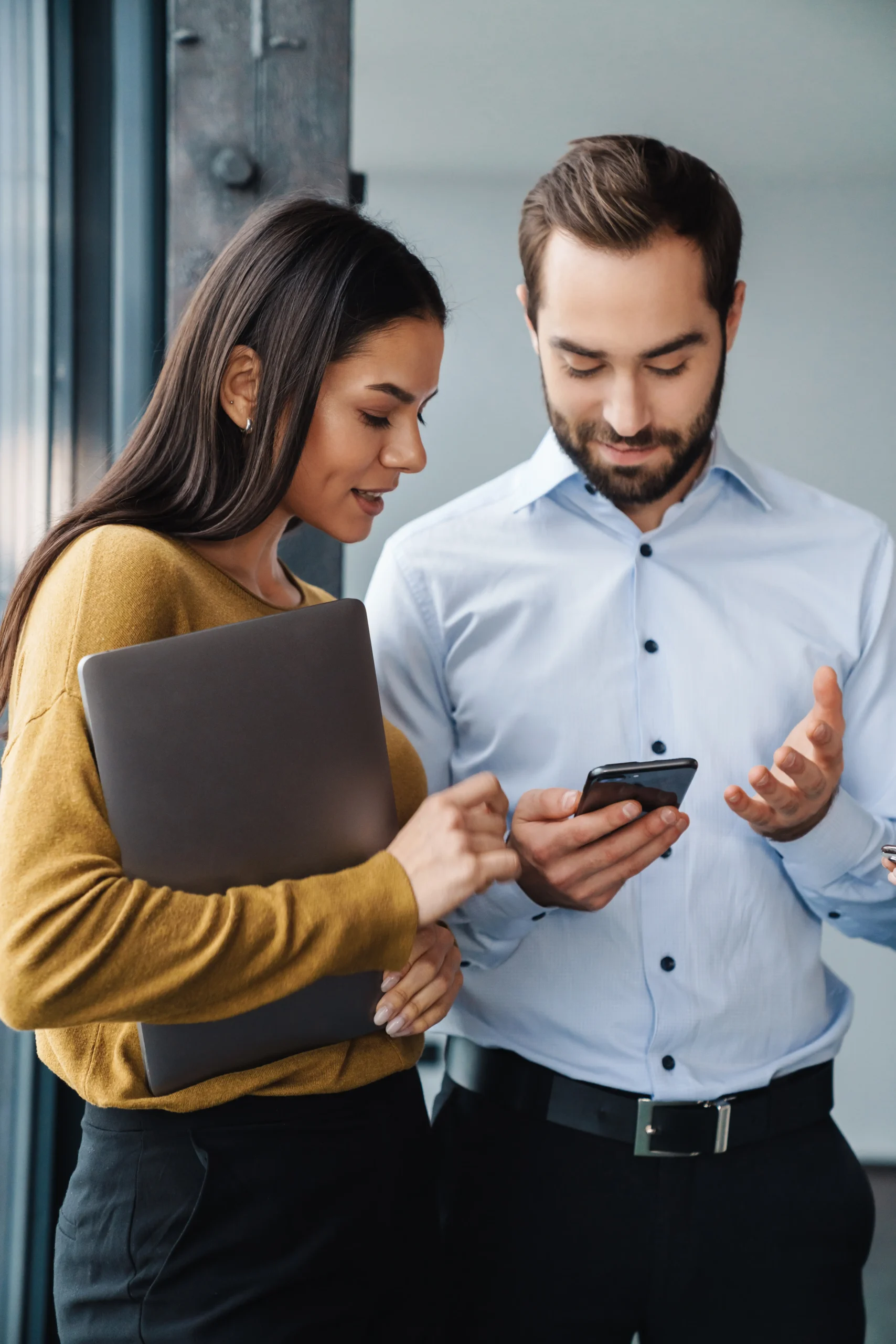 portrait-of-colleagues-talking-and-using-cellphone-2025-02-14-23-17-29-utc
